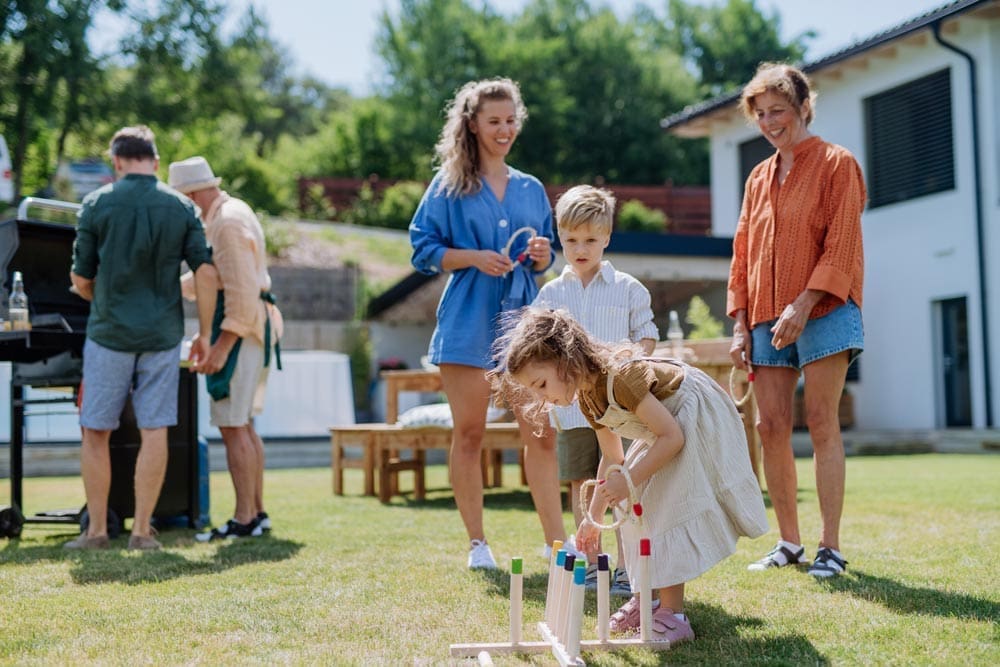 Outdoor entertaining with games and a barbecue setup.