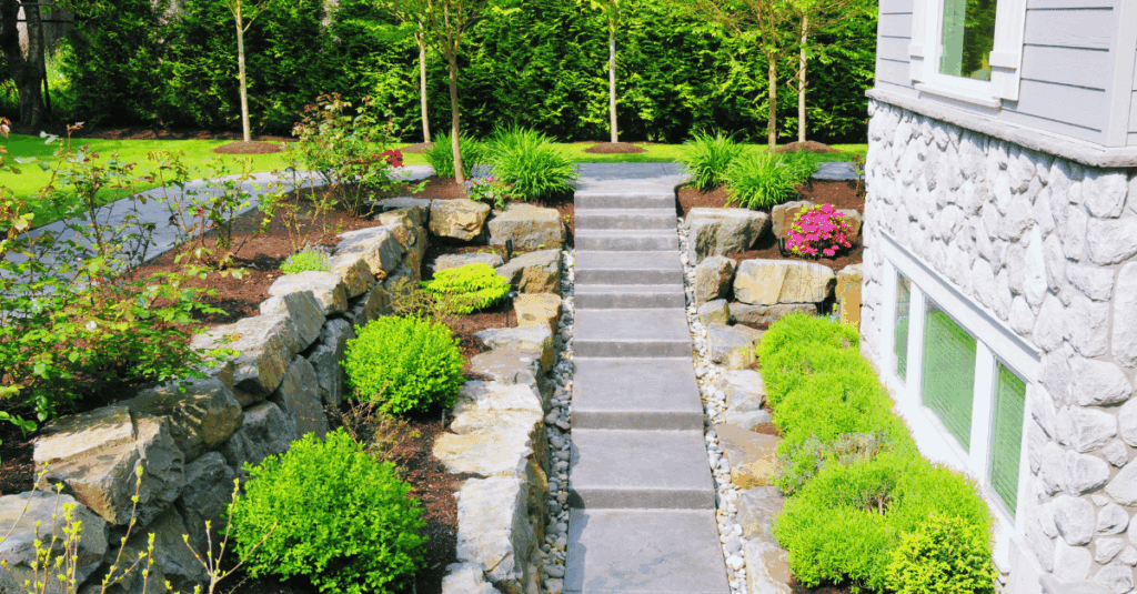 Front yard landscaping with low shrubs and stone walkway