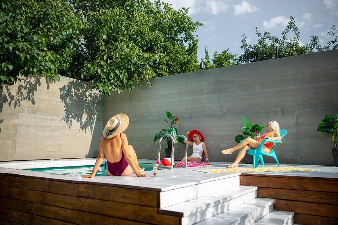 Senior ladies in swimsuits enjoying summer vacation stock photo