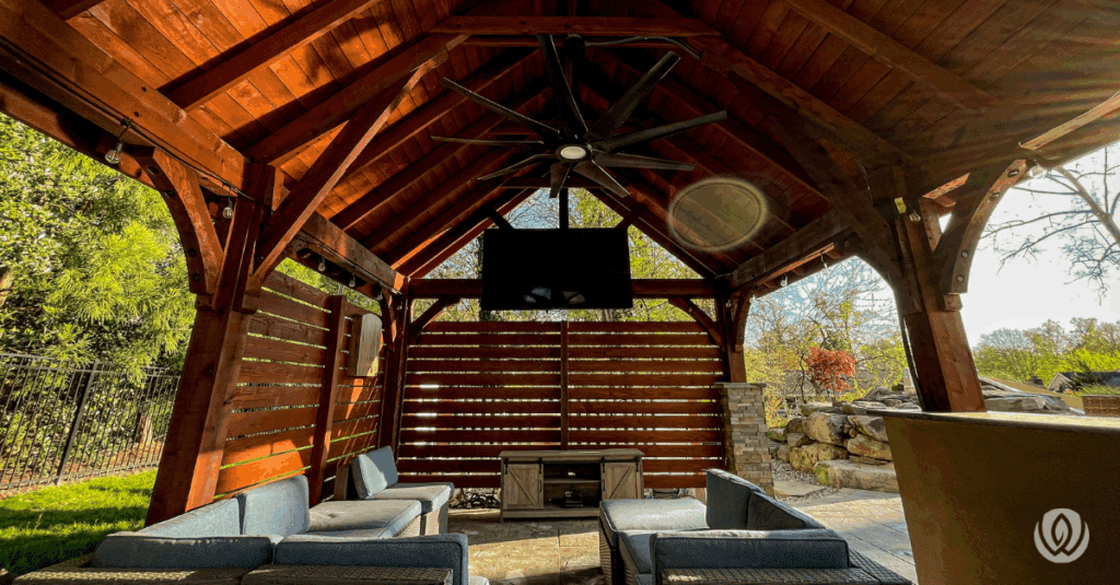 Rustic pavilion with solid roof and dining setup