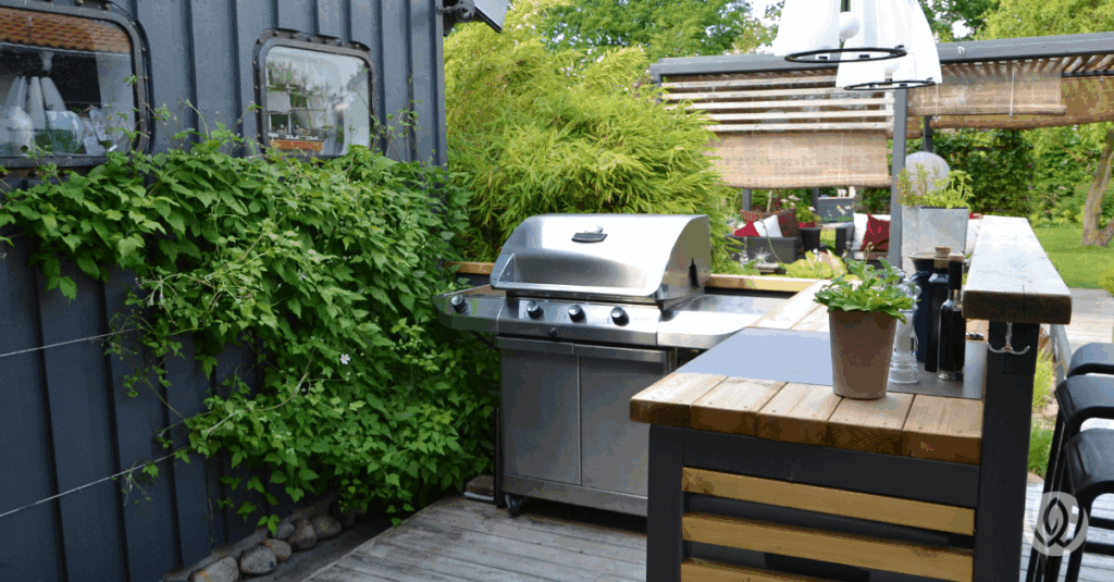 Modular outdoor station setup with grill, sink, and prep space